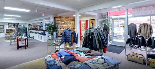Outerwear and accessories near the showroom entrance