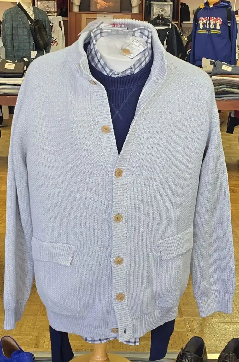Light grey button-front cardigan sweater layered over a navy shirt at Label Legends