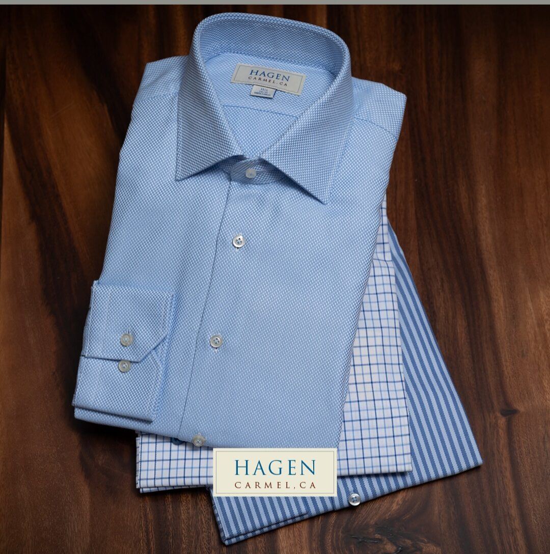 Light blue Hagen dress shirt folded with its check-pattern contrast cuff at Label Legends