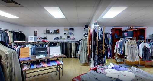 Suits, sport coats and folded knitwear on display