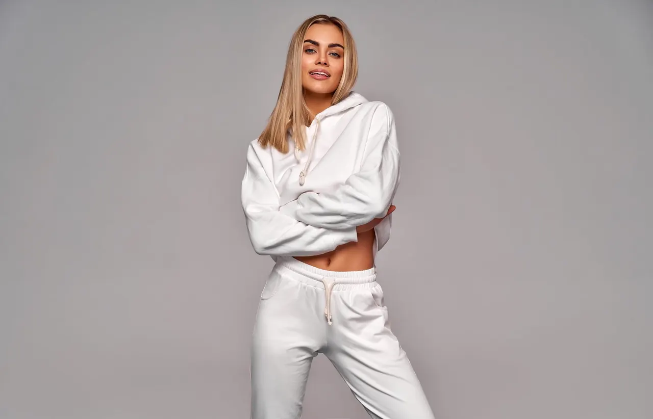 Woman in a white hoodie and matching joggers