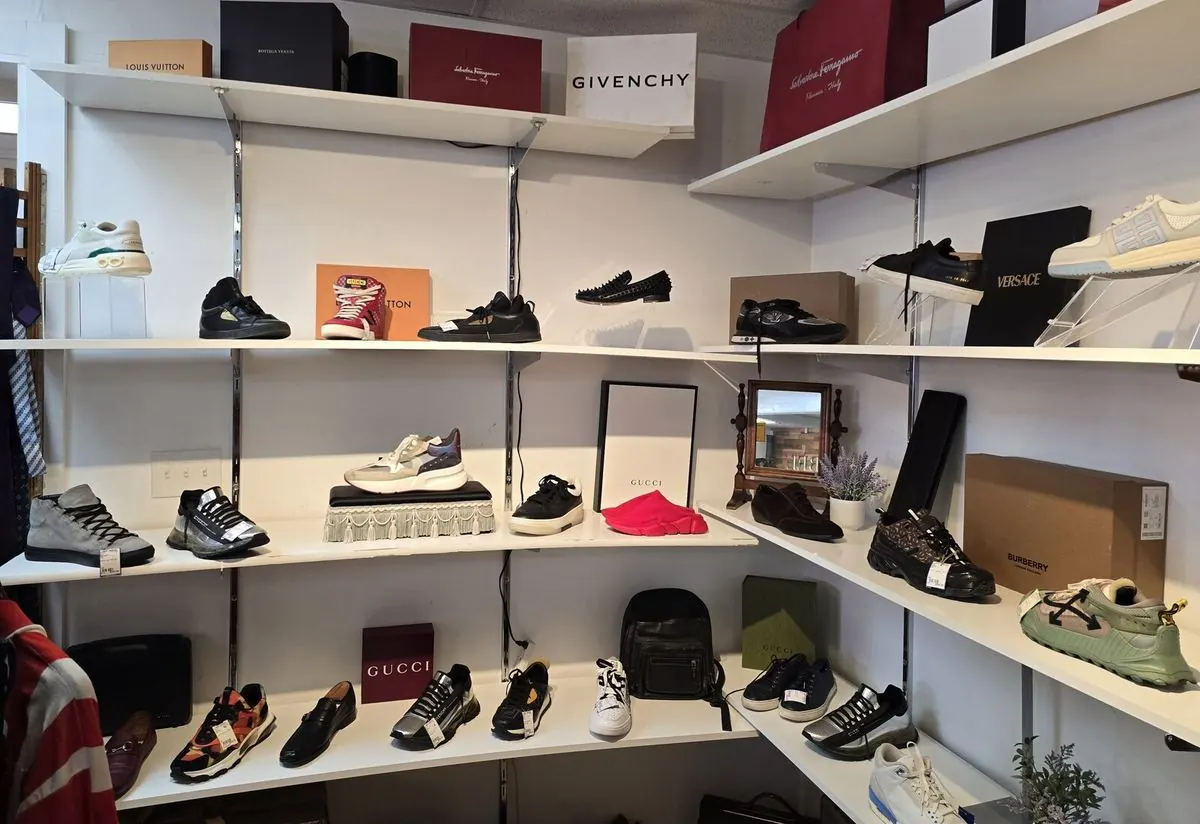 Corner shelving filled with Givenchy, Versace and Burberry shoe boxes and sneakers