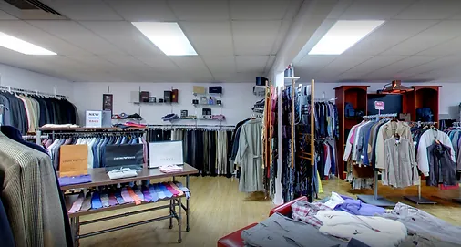 Suits, sport coats and folded knitwear on display