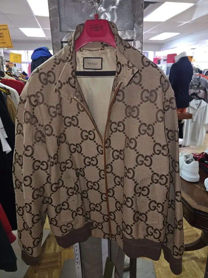 Gucci GG monogram canvas bomber jacket on display in the showroom