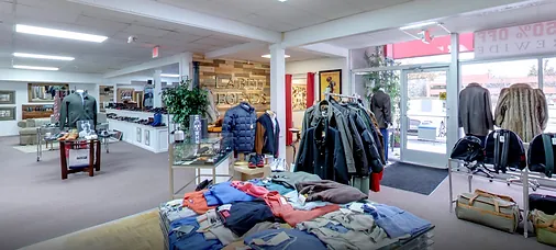 Outerwear and accessories near the showroom entrance
